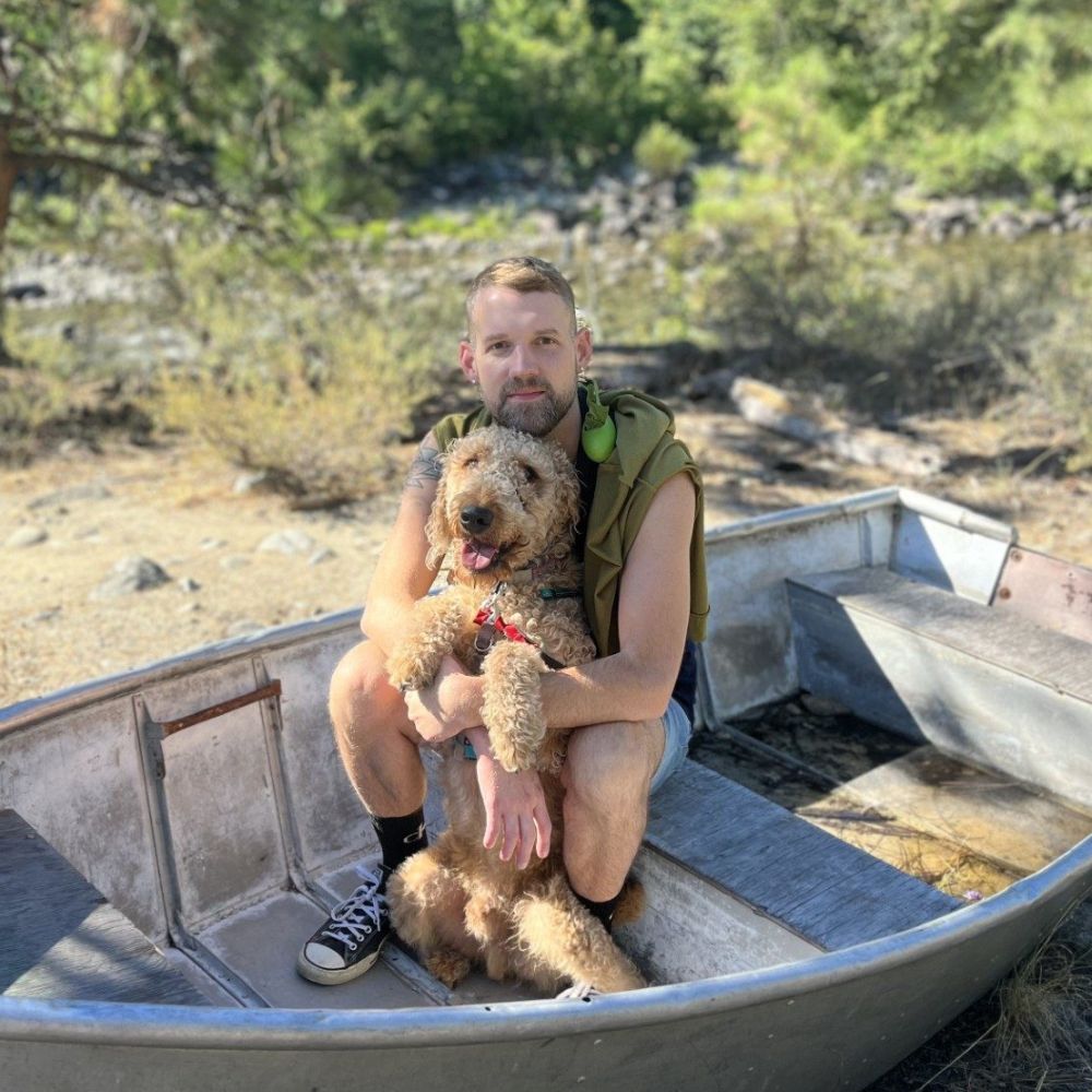 James and his Airedale, Manager on the Veterinary Roots Leadership Team